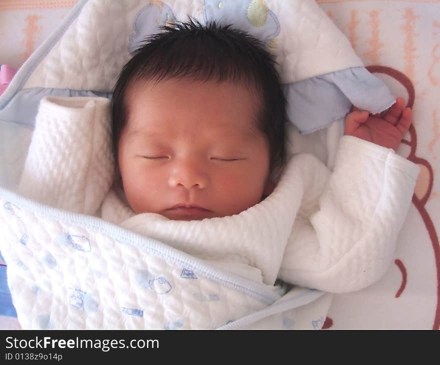 Sleeping Baby on a bed