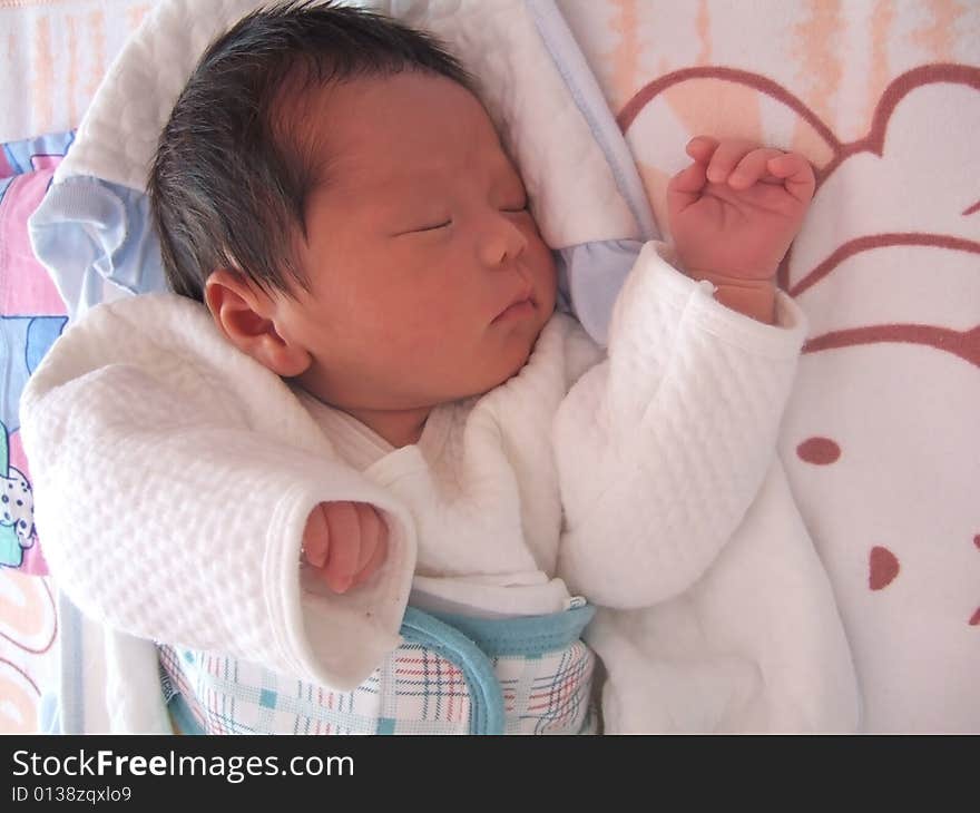 Sleeping Baby on a bed