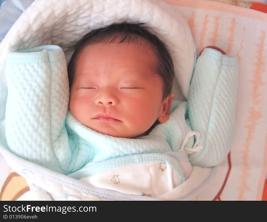 Sleeping Baby on a bed