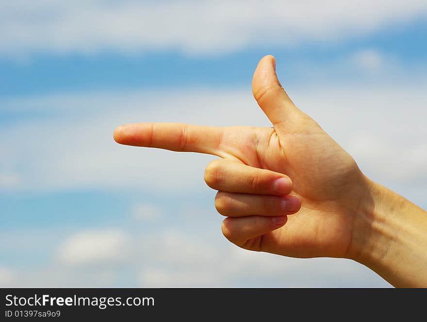 Hand pointing with index finger against a white background