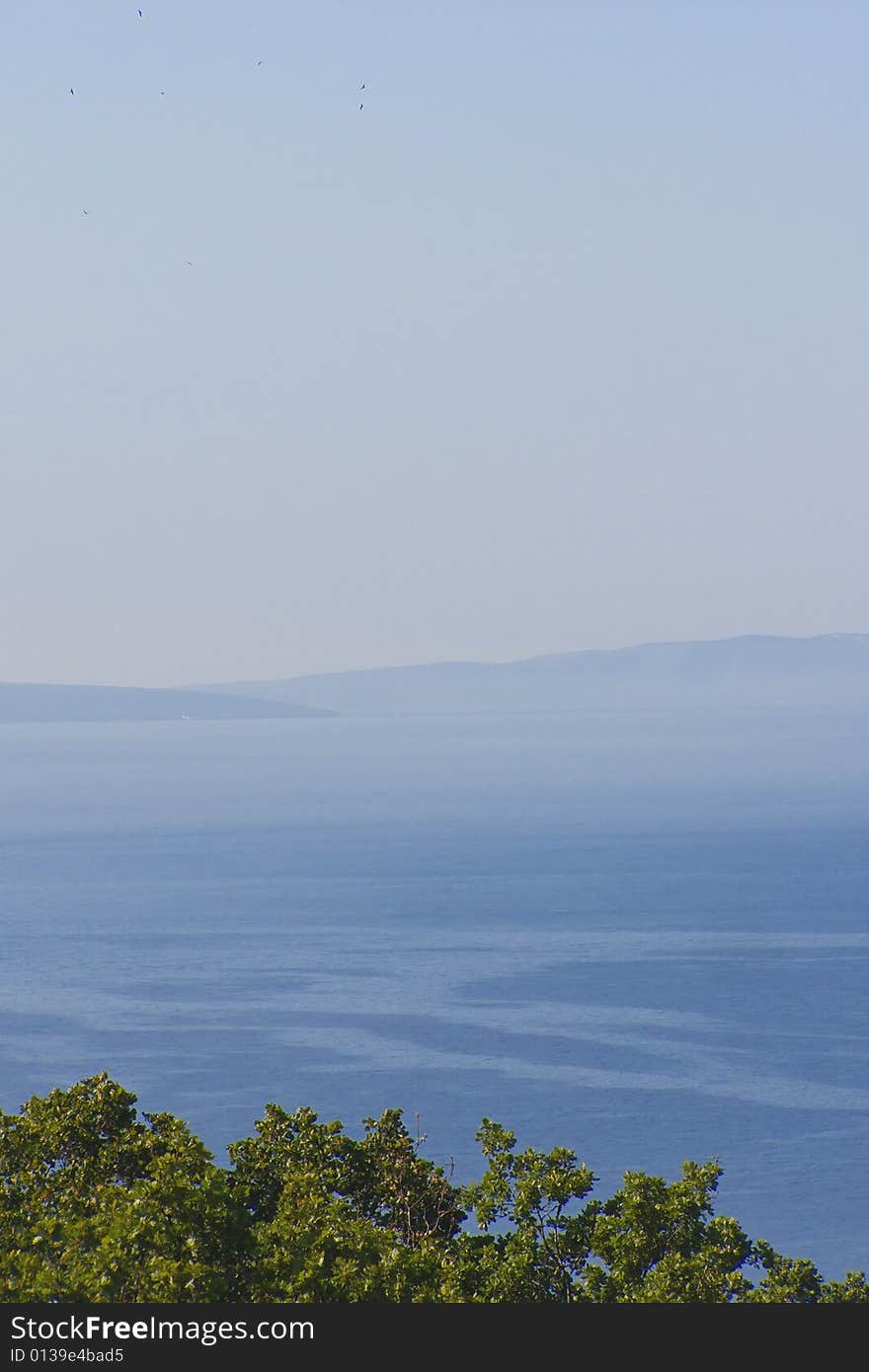 Big blue sea and islands in the morning mist
Postcard of the Adriatic: mist around the Croatian islands of Krk and Cres, lush Mediterranean vegetation, clear blue sky with distant seagulls

*with space for text (copyspace). Big blue sea and islands in the morning mist
Postcard of the Adriatic: mist around the Croatian islands of Krk and Cres, lush Mediterranean vegetation, clear blue sky with distant seagulls

*with space for text (copyspace)