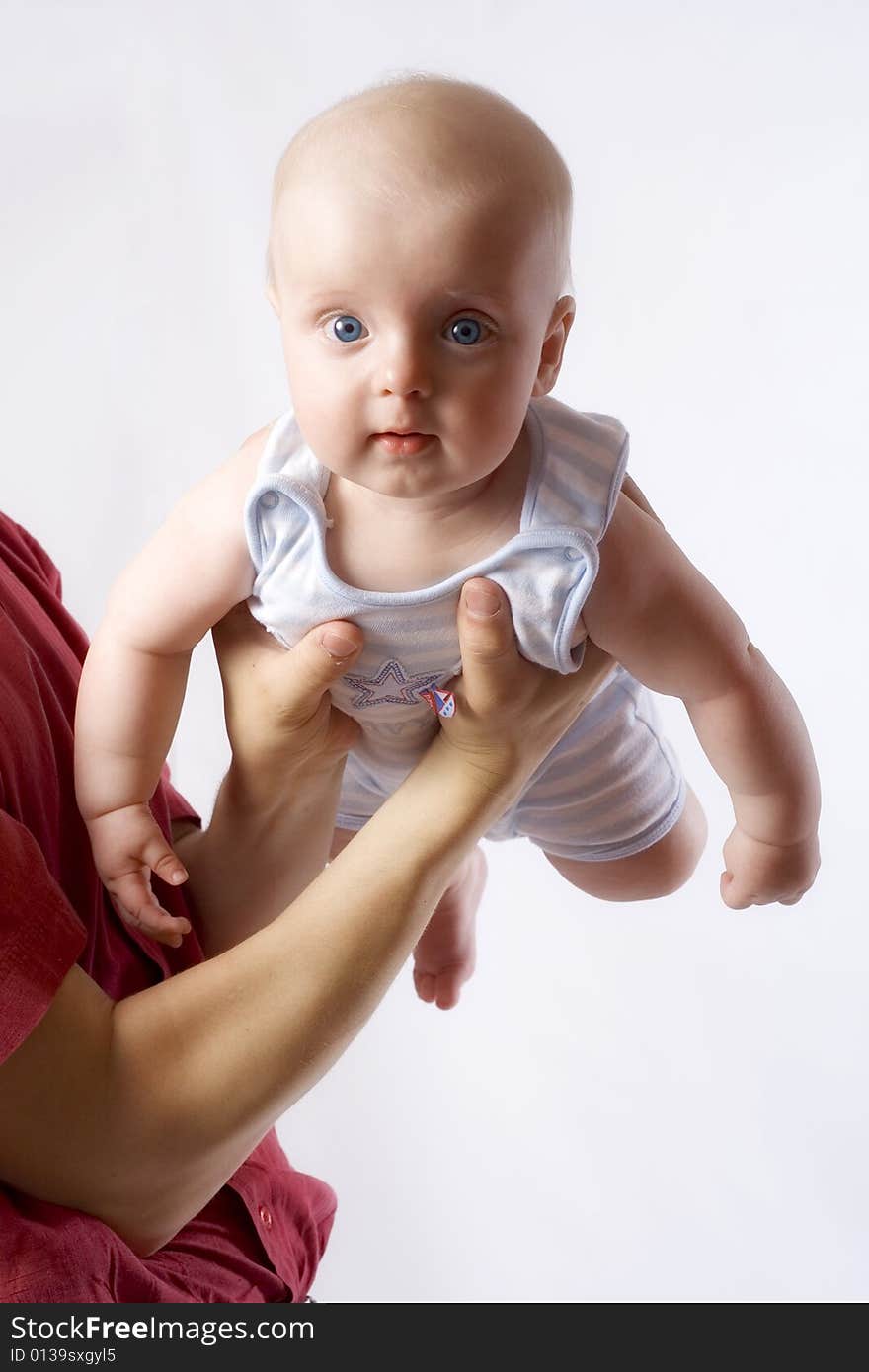 Baby on father`s hands