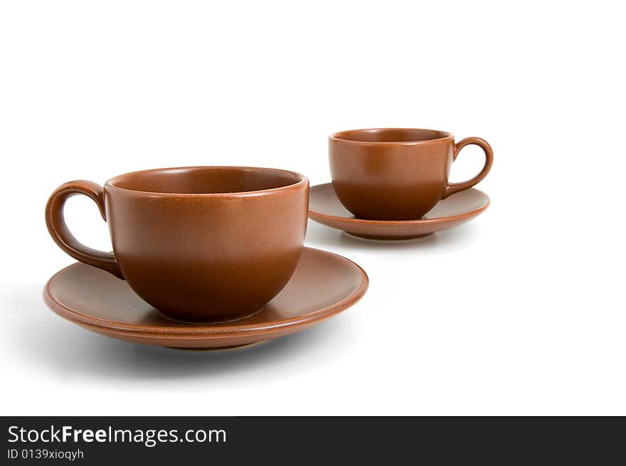 Coffee cups and saucers isolated on white background. Coffee cups and saucers isolated on white background