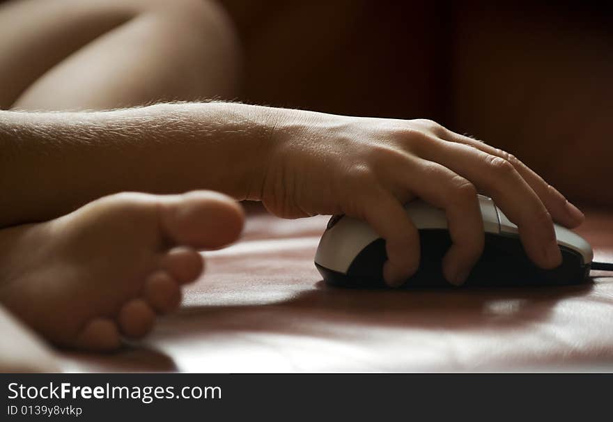 Childrens hand on a computermouse. Childrens hand on a computermouse