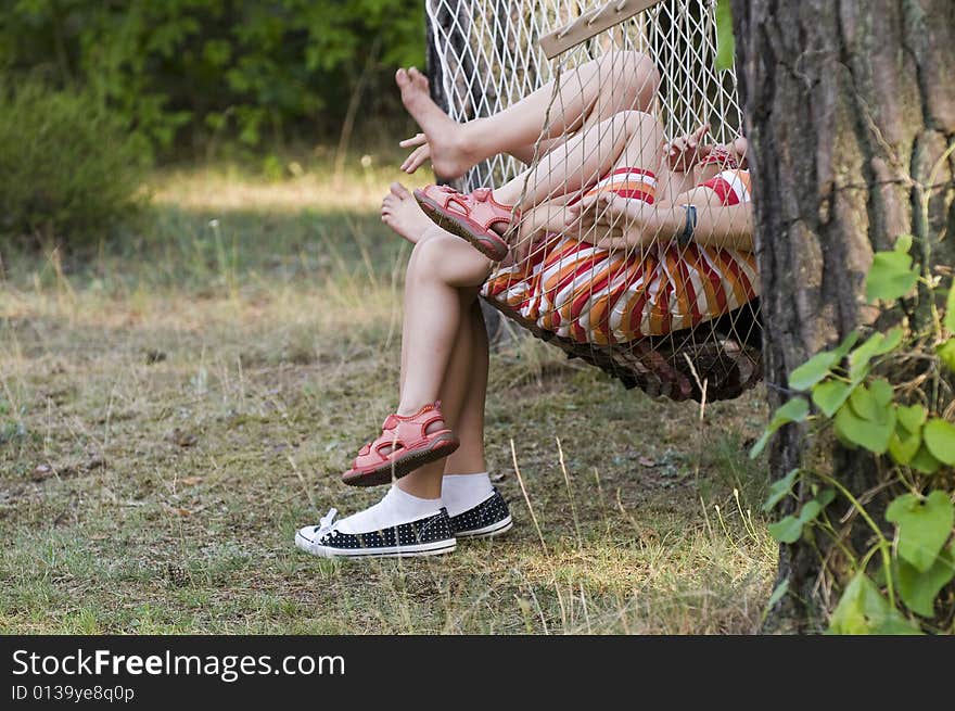 Little girls legs on a hammock