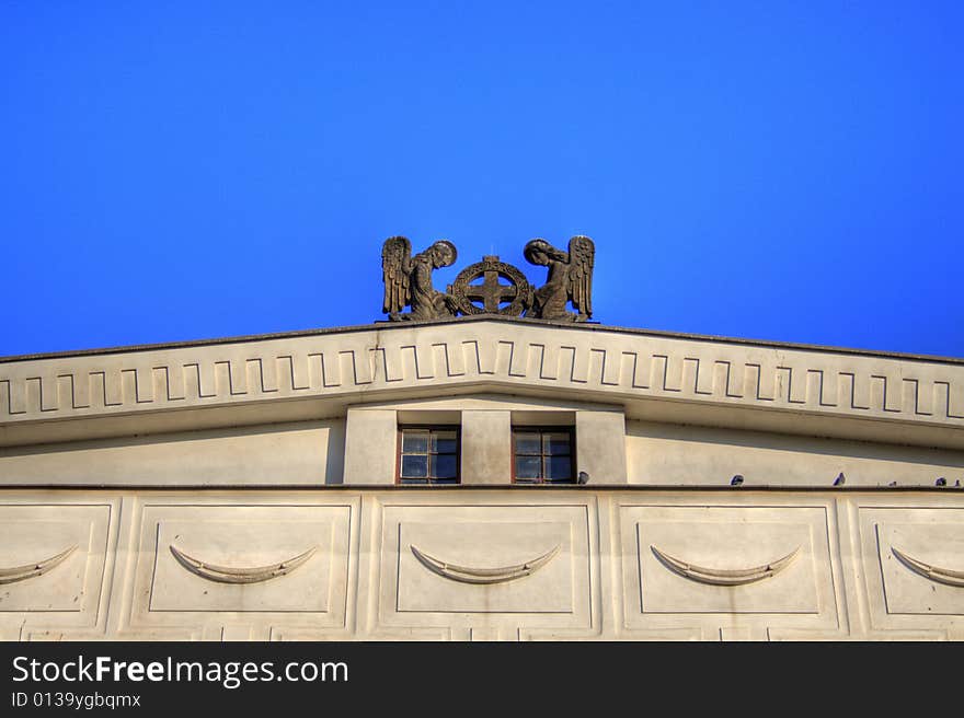 Statue of two angels on the roof of Prague church. By architect Josip Plecnik. Statue of two angels on the roof of Prague church. By architect Josip Plecnik.