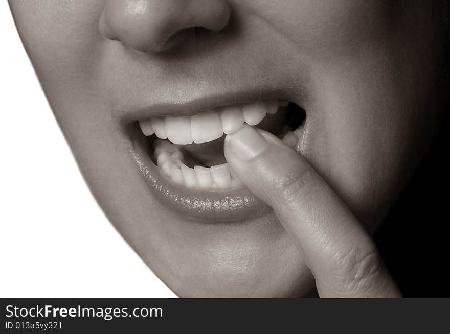 Woman Ponders with finger in her mouth. Woman Ponders with finger in her mouth