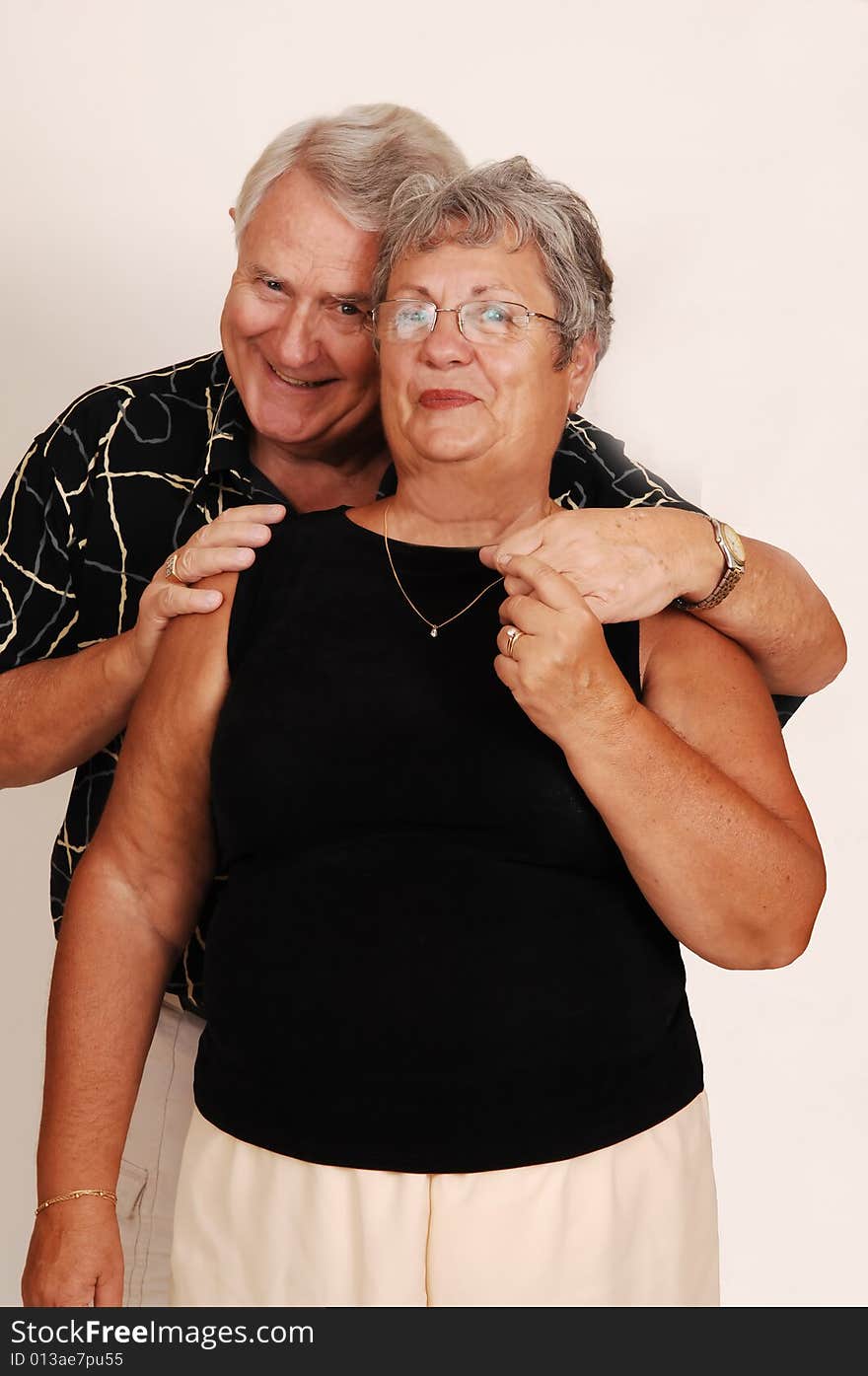 An happy senior couple smiling and happy in front of the camera. An happy senior couple smiling and happy in front of the camera.