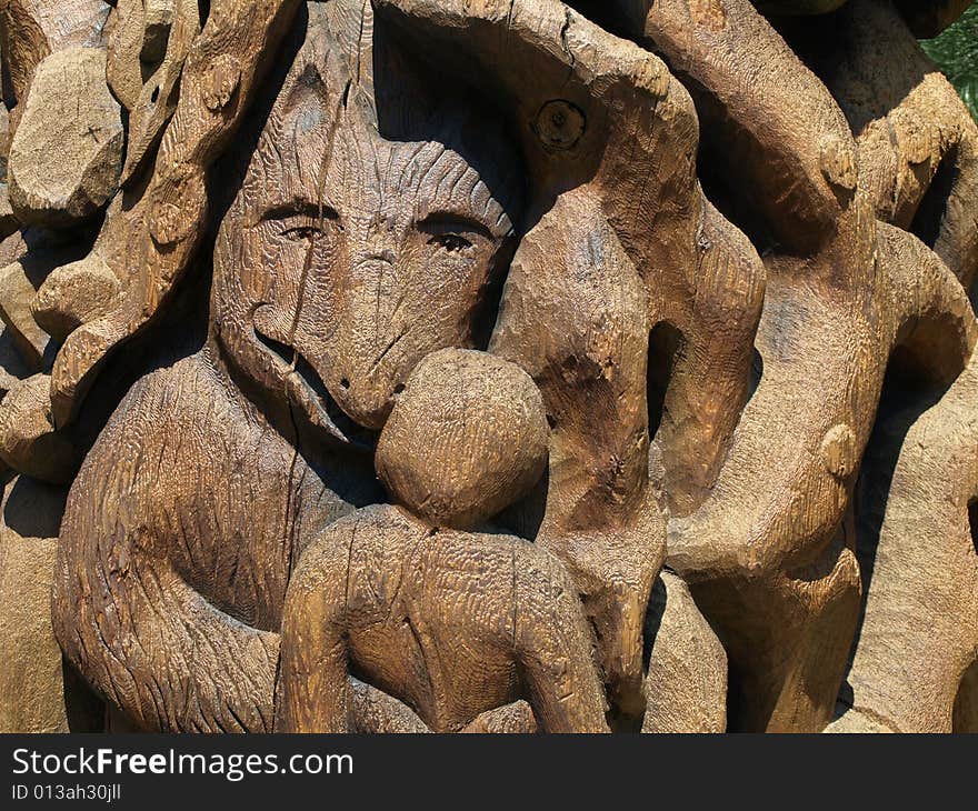 A wooden carving of a wolf, carved into a totem pole. A wooden carving of a wolf, carved into a totem pole.