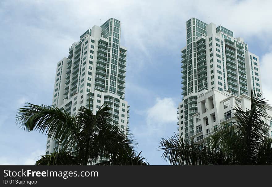 Luxurious condominiums with a cloudy blue sky in the background. Luxurious condominiums with a cloudy blue sky in the background