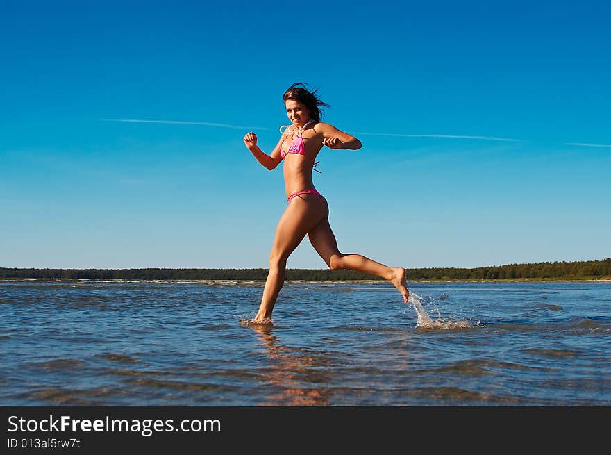 Woman Runnig In Water