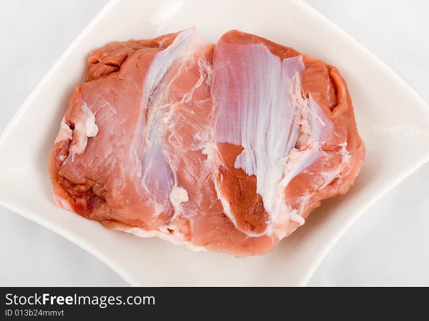 Piece of fresh meat isolated on white background