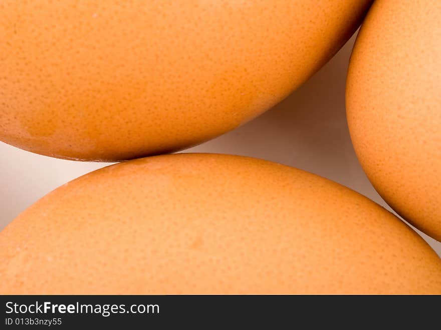 Brown eggs in white square plate isolated