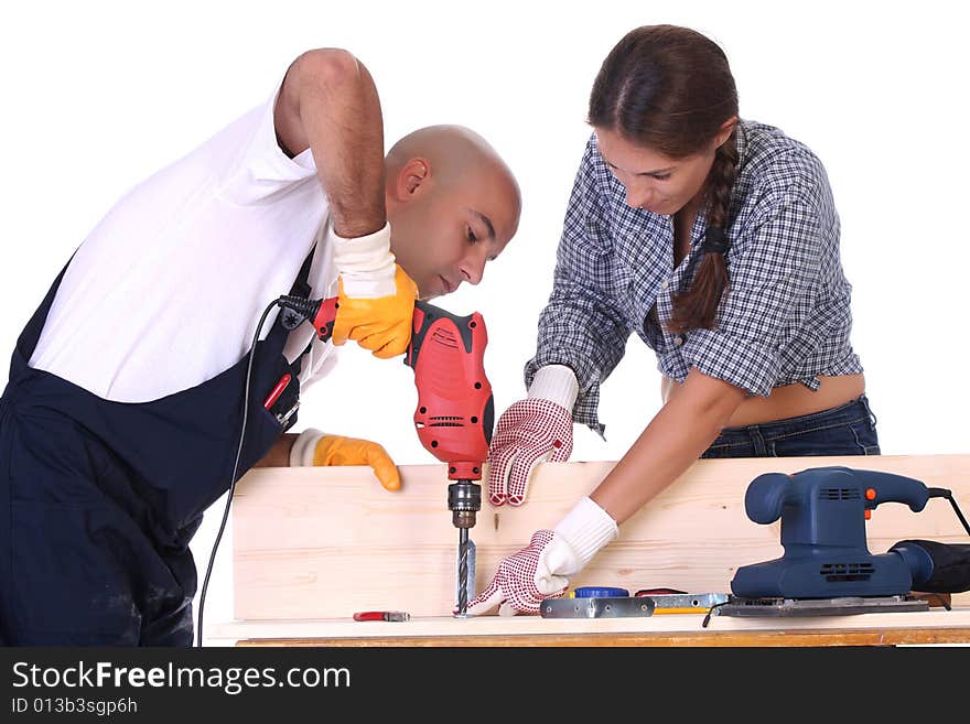 Construction workers at work on white background