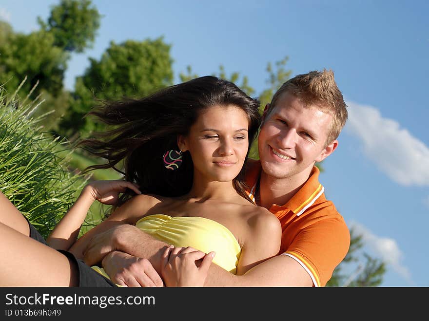 Portrait young beautiful girls and the guy on nature. Portrait young beautiful girls and the guy on nature