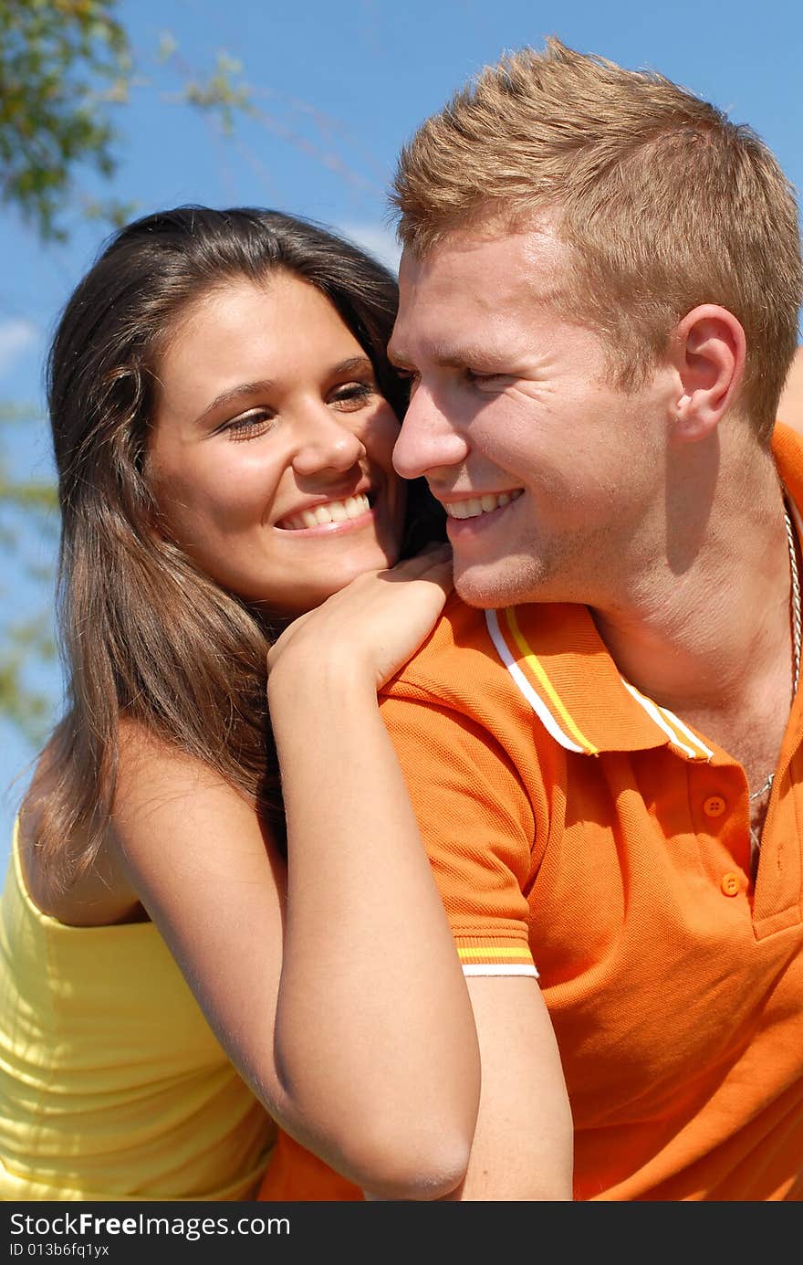 Portrait young beautiful girls and the guy on nature. Portrait young beautiful girls and the guy on nature