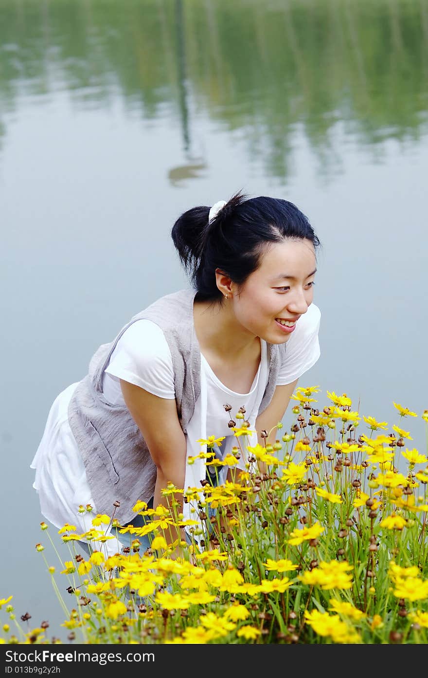 Young girl smell flowers