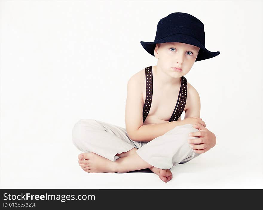 Portrait of little boy in the black hat