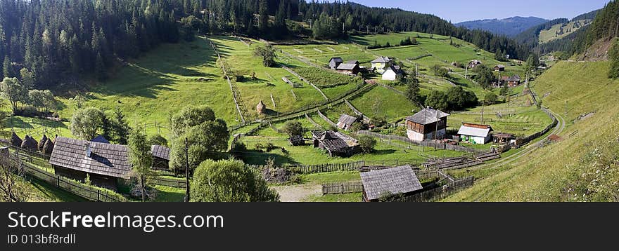 Rural landscape with lush green fields and farm house