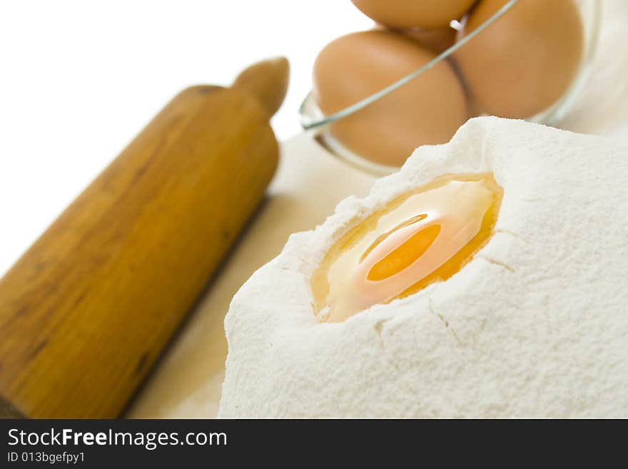 Rolling pin,eggs and flour. Rolling pin,eggs and flour