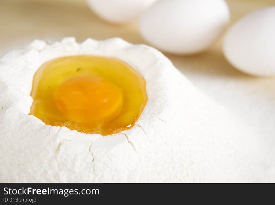 Eggs and flour on table