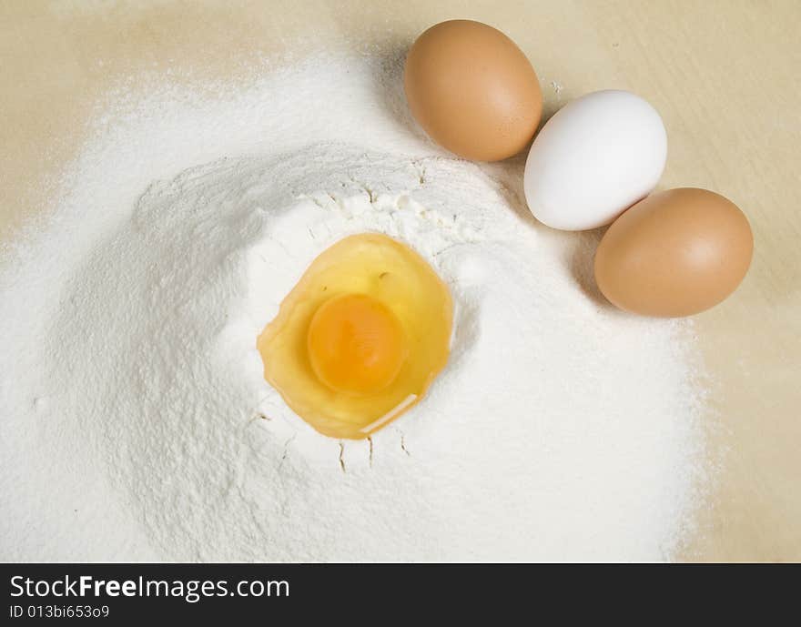 Eggs and flour on table