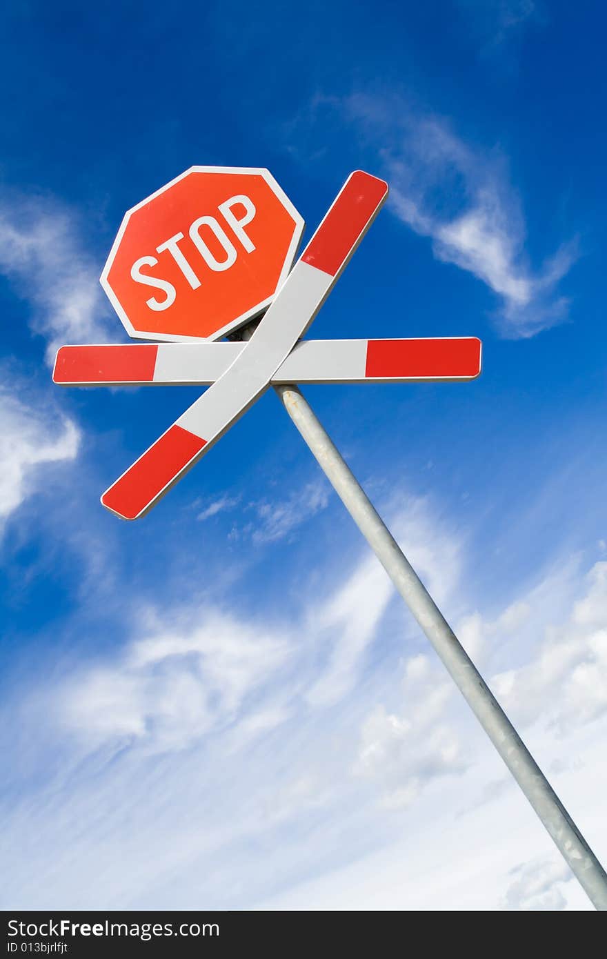 Traffic sign over cloudy sky