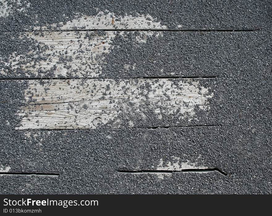 Detail of rock texture on wooden slat