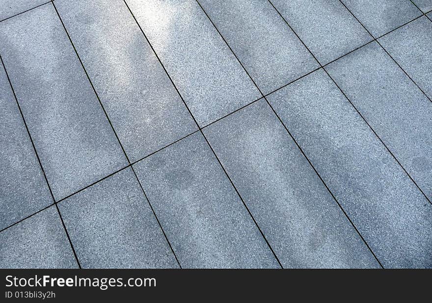 A photograph of some rectangle pavement slabs. A photograph of some rectangle pavement slabs.