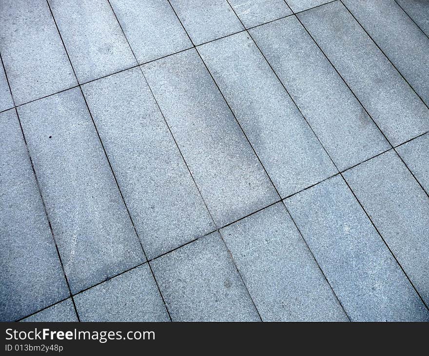 A photograph of some rectangle pavement slabs. A photograph of some rectangle pavement slabs.