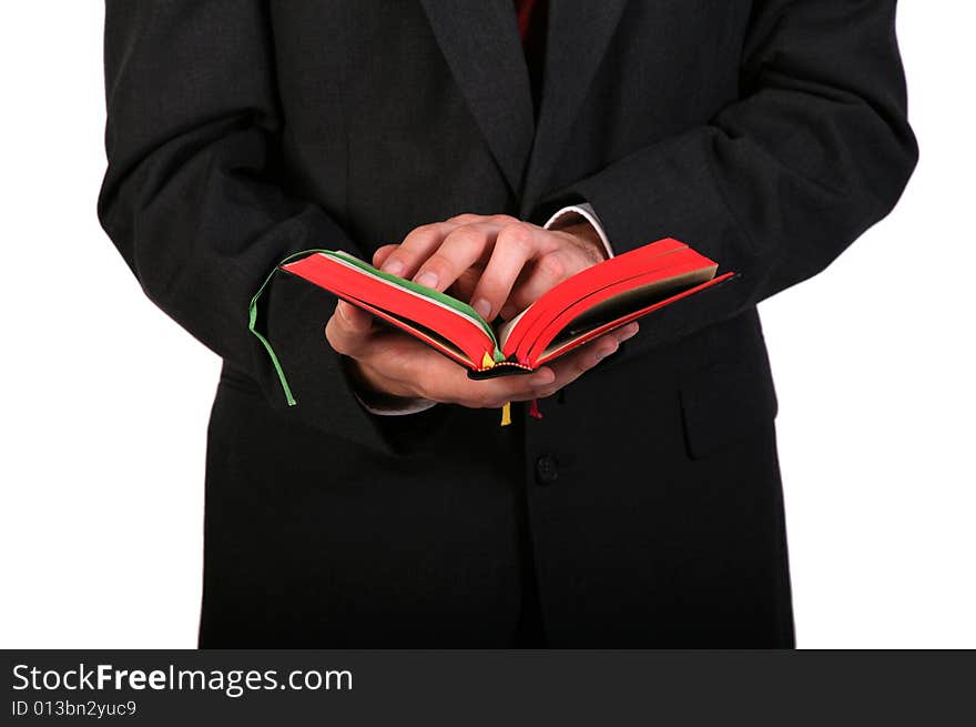 Man in suit holding bible in his hands. Man in suit holding bible in his hands