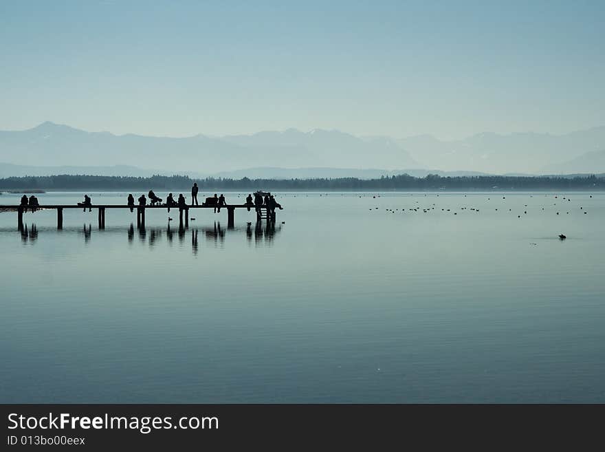 People on a footbridge (morning, Starnberger lake, Bavaria, Germany)