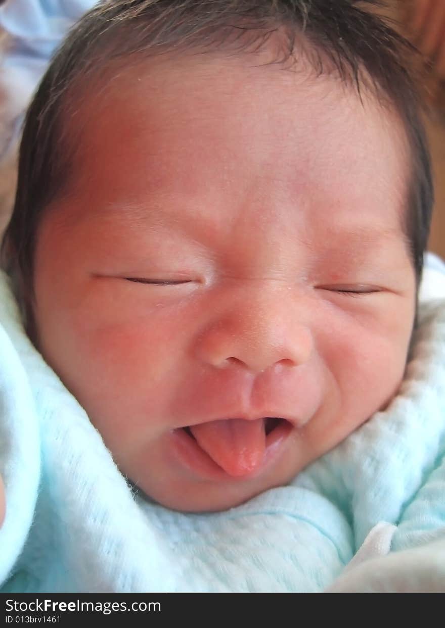 Adorable Infant on a bed