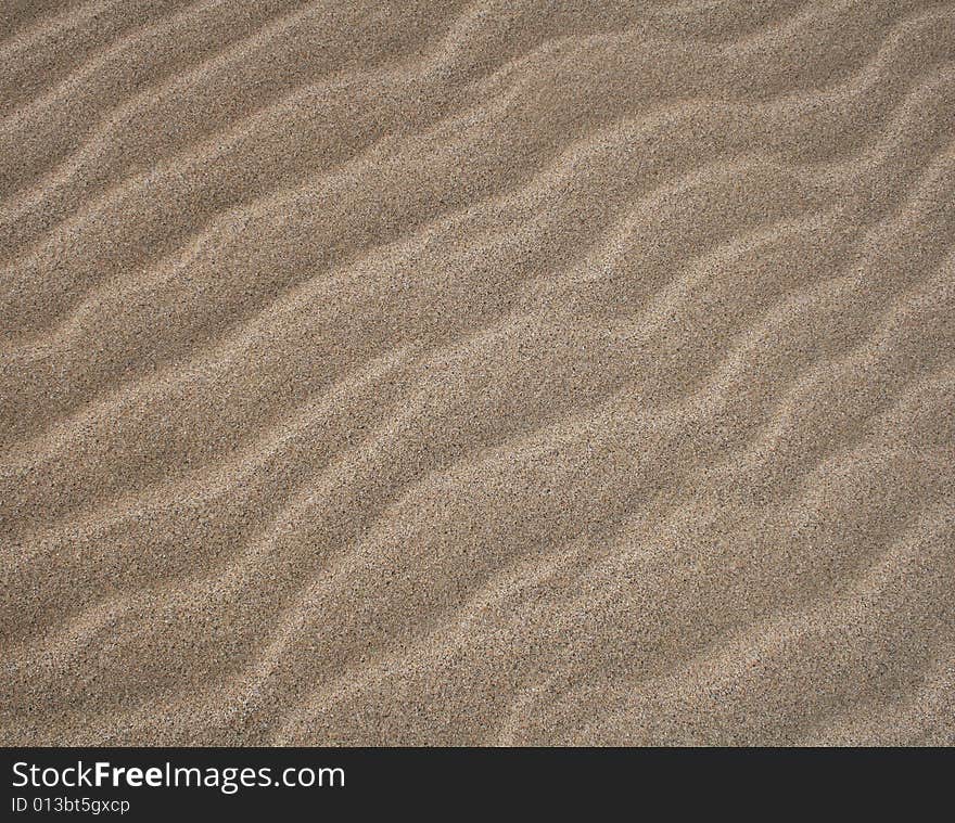 Wave patterns on a sand beach. Wave patterns on a sand beach.