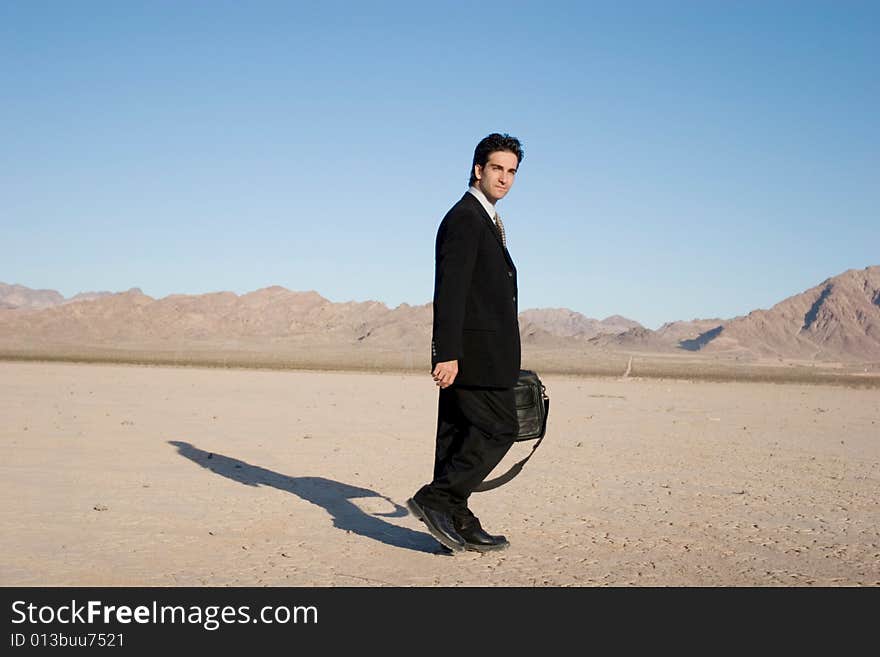 Businessman carrying his laptop case. Businessman carrying his laptop case