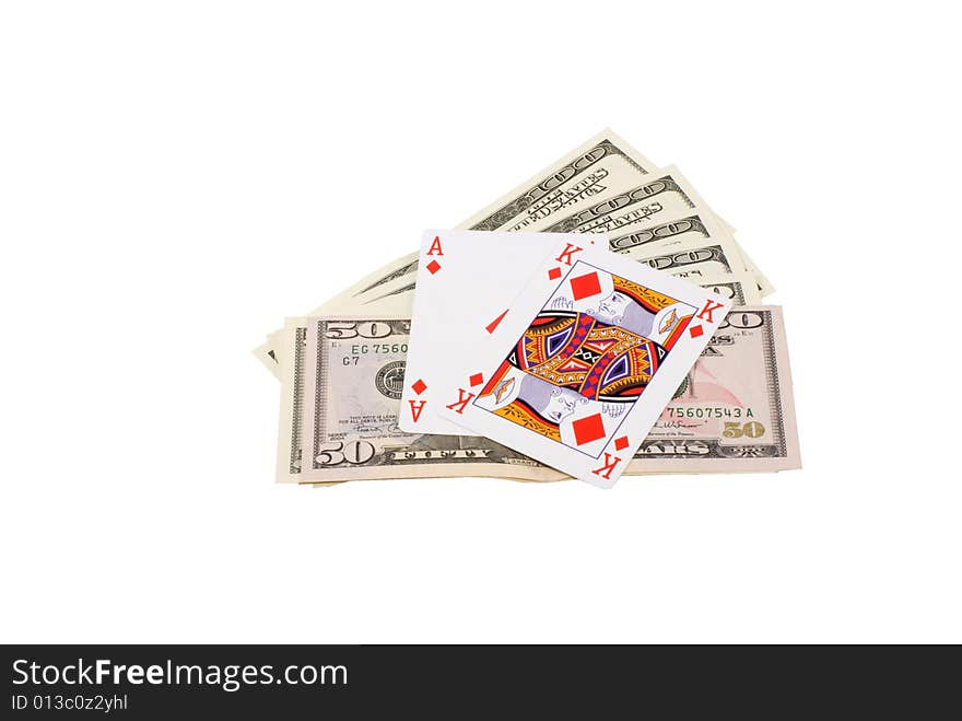 The card combination black Jack, lays on the dollars spread out by a fan