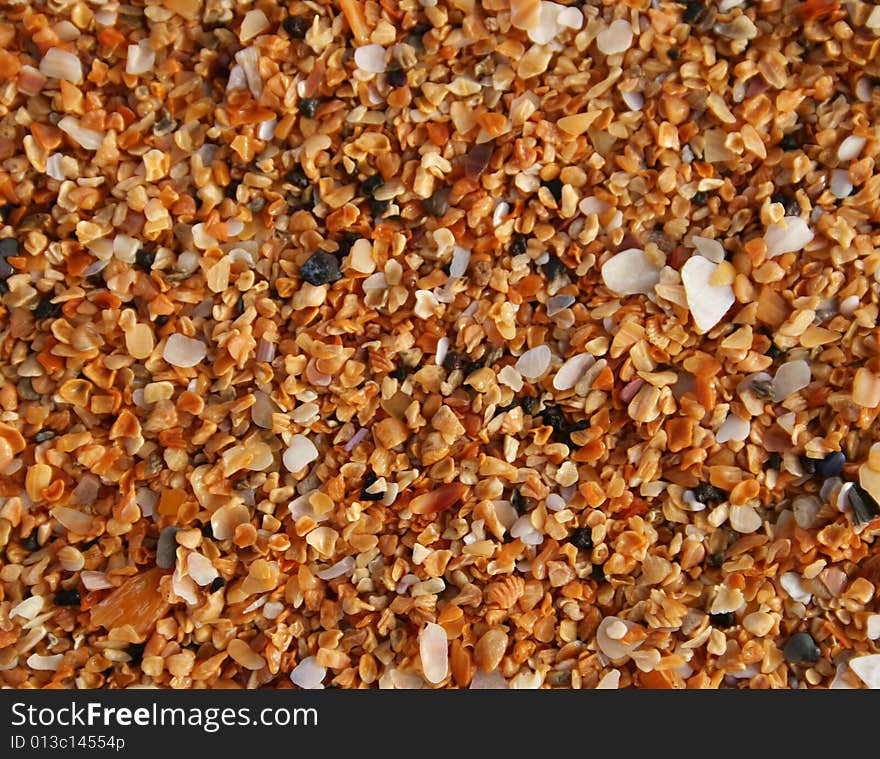 The sand of orange Raudisandur beach (Iceland). The orange sand are actually broken sea shells that give the beach its famous color. The sand of orange Raudisandur beach (Iceland). The orange sand are actually broken sea shells that give the beach its famous color.