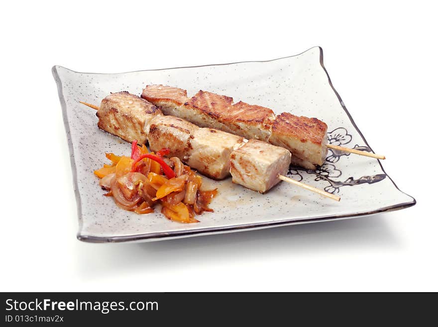 Japan Shish Kebab from Fish with Vegetables. Isolated on White Background. Japan Shish Kebab from Fish with Vegetables. Isolated on White Background