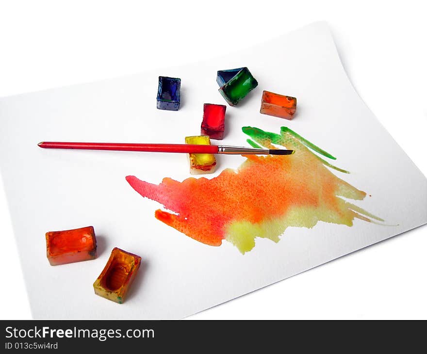 Watercolors and brush isolated on whte background