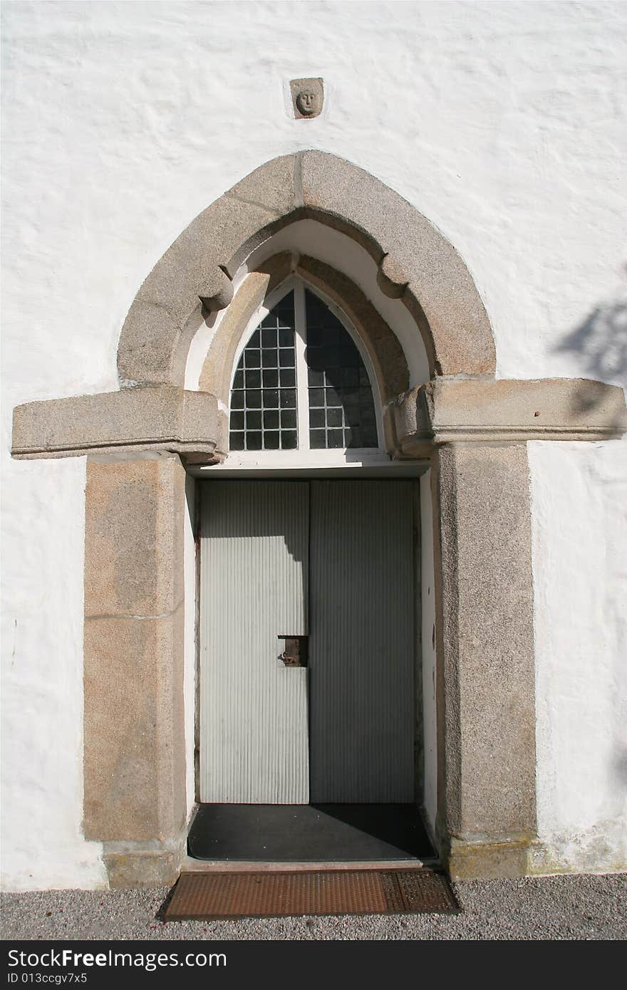 White stone church, Skjeberg Sarpsborg. Norway
Entrance with stone head. White stone church, Skjeberg Sarpsborg. Norway
Entrance with stone head