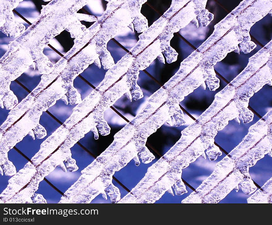 Ice on the fence after the snow has melted