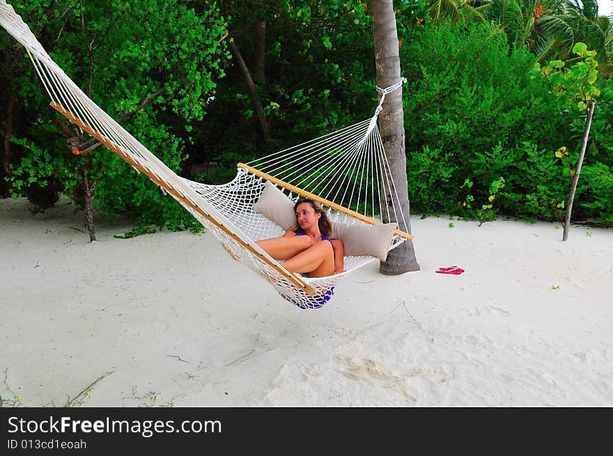 Woman lying on the hammock