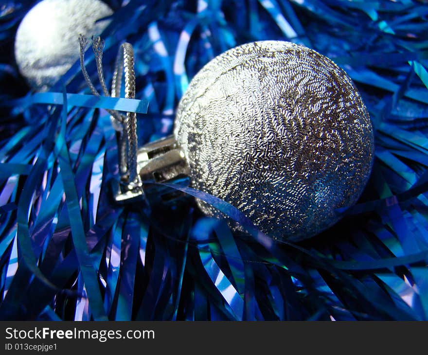 New Year's silver toys and blue decoration. New Year's silver toys and blue decoration