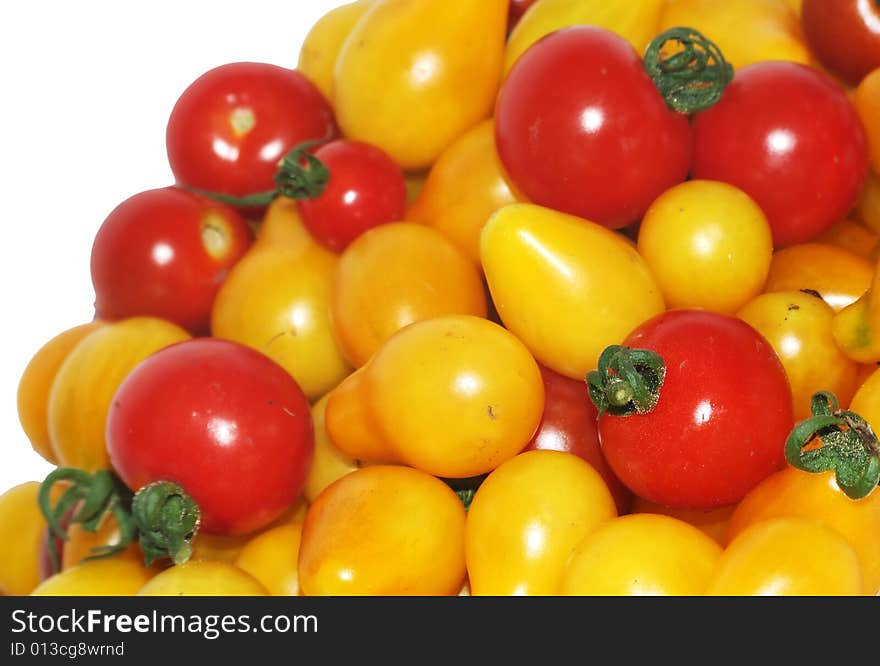 Lot of yellow and red tomatoes