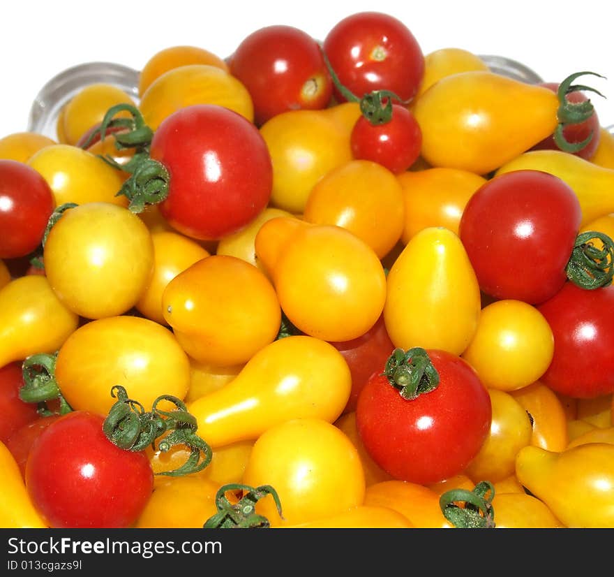 Lot of yellow and red tomatoes