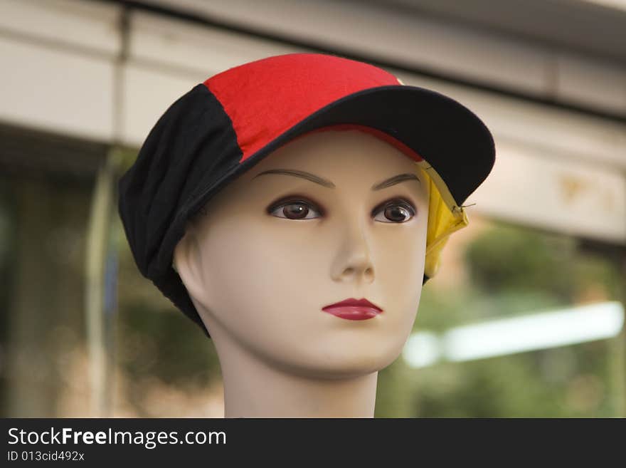 Close-up image of a mannequin of a young person with a hat. Close-up image of a mannequin of a young person with a hat