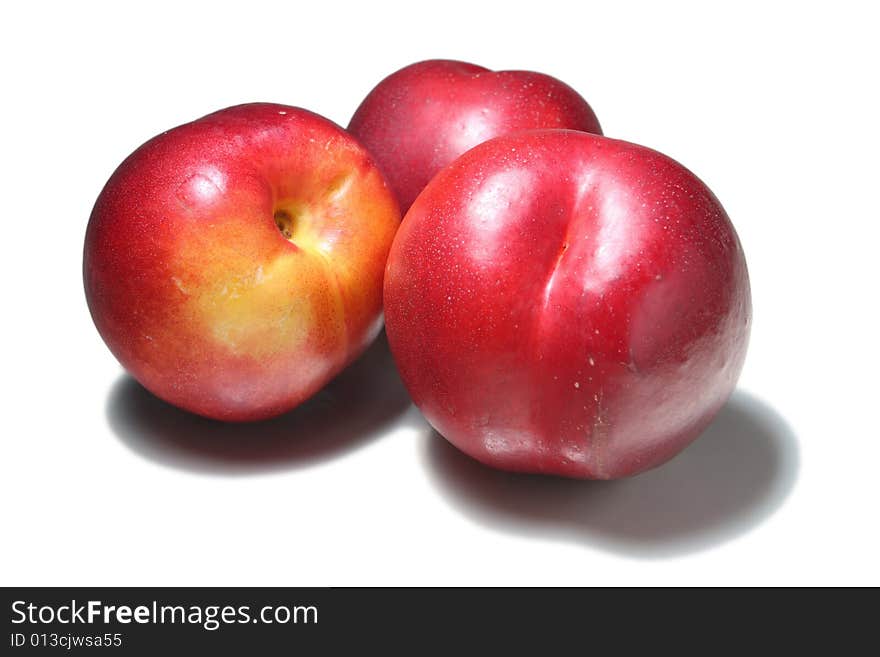 Three nectarines isolated on white