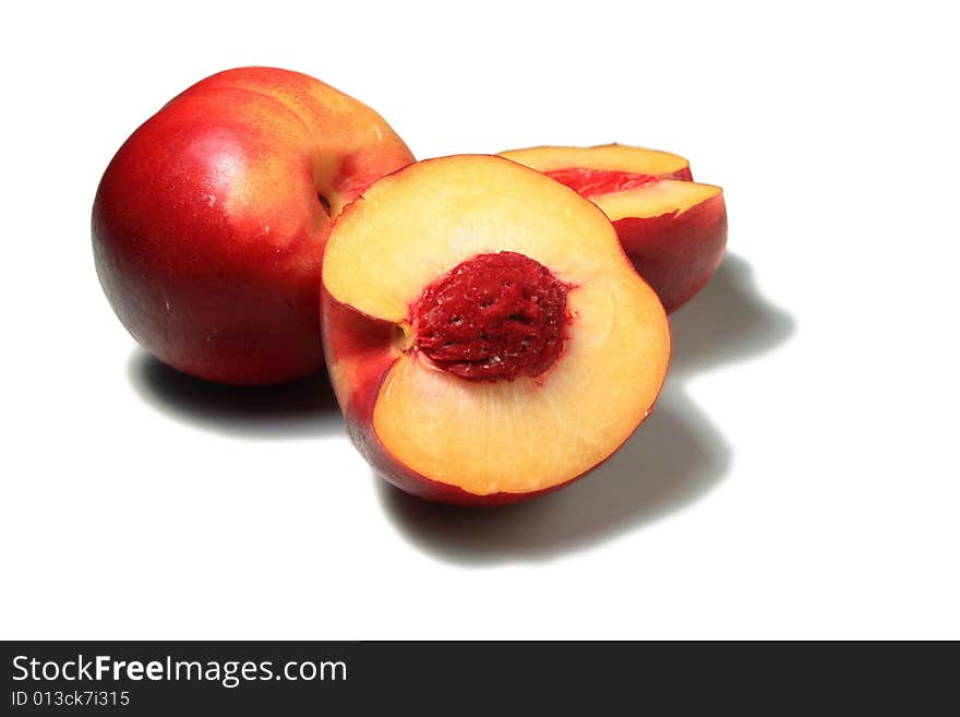 Fresh nectarines isolated cut in half