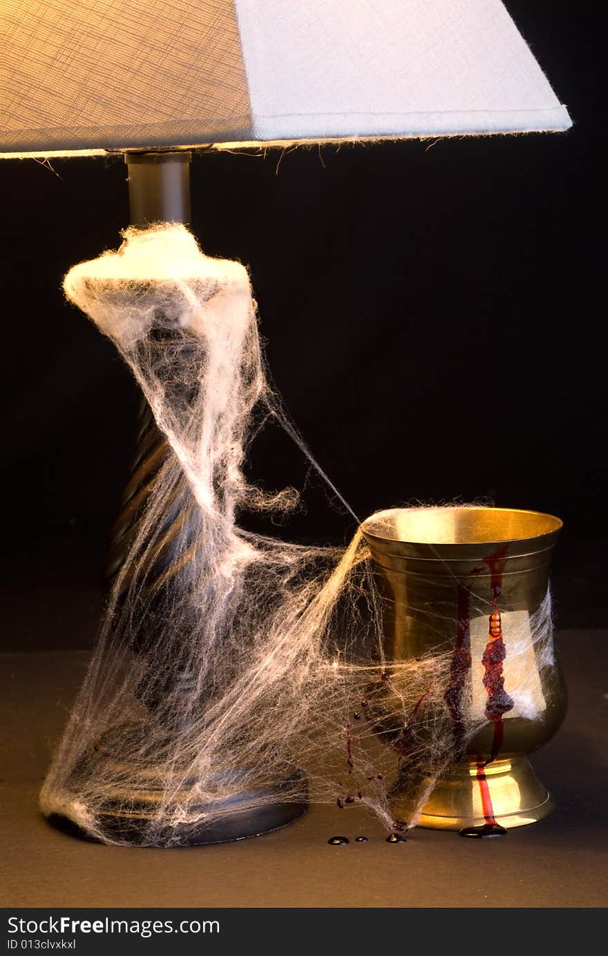 Light And Goblet In Cobwebs