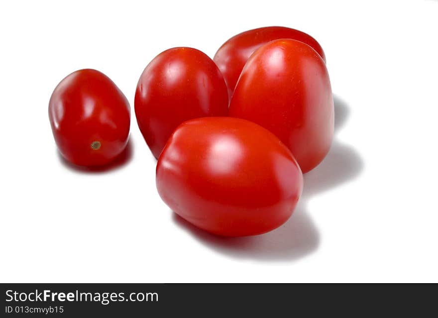 Five tomatoes isolated on white